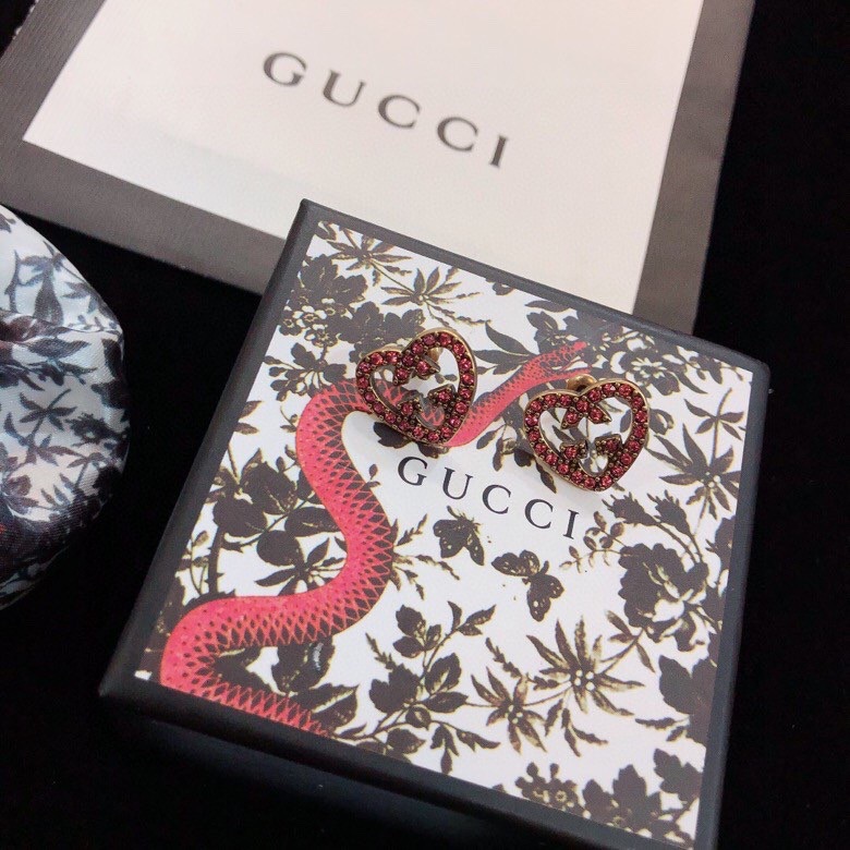 G*u*i earrings
